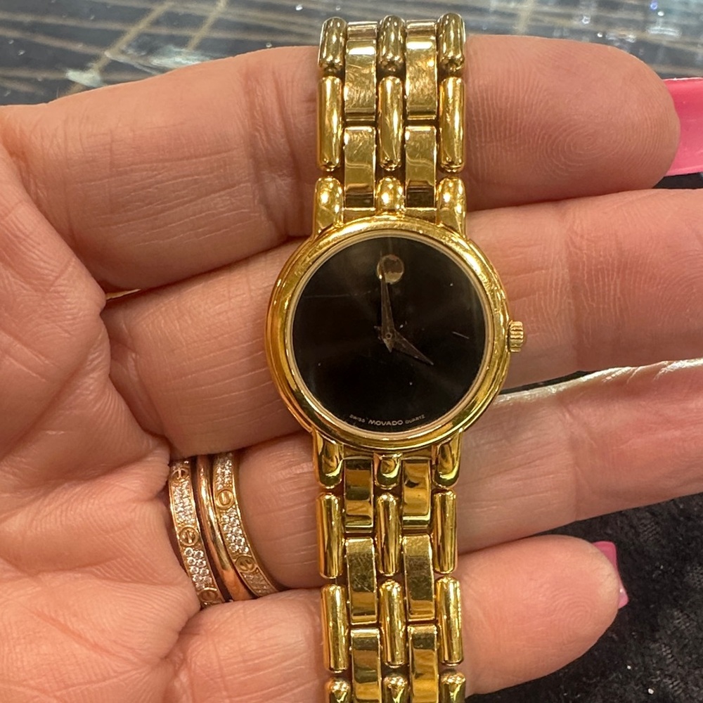 Ladies Movado Gold and Black Link Bracelet Watch.  Quartz movement